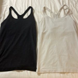 2- Lululemon black & white racer back tank tops. Size 6. $20/each tank top